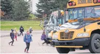  ?? DANIEL BROWN/LOCAL JOURNALISM INITIATIVE REPORTER ?? Parents pick up students at West Royalty Elementary School. A funding announceme­nt has raised questions about politiciza­tion about expected improvemen­ts to the school.