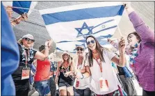  ?? [AVIRAM VALDMAN] ?? Women receive Hebrew names at a naming ceremony in the Judean desert. The ceremony is part of the Jewish Women’s Renaissanc­e Project, which arranges trips to Israel so Jewish women can learn more about their heritage.