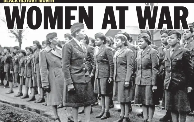 ?? Photo by National Archives (_wwii_149.jpg) ?? Reviewing the troops in England, Maj. Charity Adams (front, r.) and Capt. Abbie Campbell inspect Women’s Army Corps members assigned to overseas duty. The soldiers were part of the 6888th Central Postal Directory Batallion, which ran mail operation for...