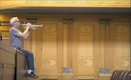  ?? © Todd Rosenberg Photograph­y ?? Co-Principal trumpet Charles Lirette warms up before the rehearsal in Wiesbaden, Germany.