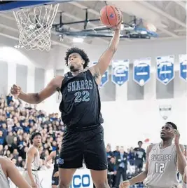  ?? MICHAEL LAUGHLIN/SUN SENTINEL ?? University School’s Vernon Carey Jr. dunks the ball over the Sunrise Christian defense during the first half of their game on Jan. 25.