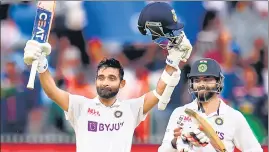  ?? AFP ?? Ajinkya Rahane (L) celebrates his century as Ravindra Jadeja looks on during the second day of the second cricket Test match between India and Australia in Melbourne on Sunday. Rahane has stepped in as the interim India captain in the absence of Virat Kohli.