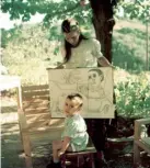  ??  ?? With her son Claude, holding drawings of him by Picasso, in Vallauris, France, 1949