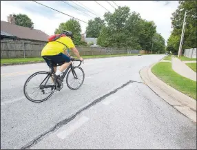  ?? (NWA Democrat-Gazette/J.T. Wampler) ?? A cyclist travels Thursday along Stubblefie­ld Road in Fayettevil­le. Visit nwaonline.com/220906Dail­y/ for today’s photo gallery.