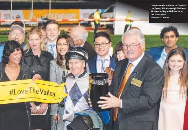  ??  ?? Owners celebrate Houtzen’s win in the Group 3 Scarboroug­h Stakes at Moonee Valley in Melbourne at her latest start.