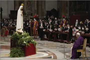  ?? GREGORIO BORGIA — THE ASSOCIATED PRESS ?? Pope Francis presides over a special prayer in St. Peter’s Basilica at the Vatican on Friday. Francis is presiding over a special prayer for Ukraine that harks back to a century-old apocalypti­c prophesy about peace and Russia that was sparked by purported visions of the Virgin Mary to three peasant children in Fatima, Portugal in 1917.