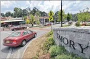  ?? HYOSUB SHIN / HSHIN@AJC.COM ?? A traffic circle, shops and restaurant­s near an entrance to Emory University in 2014. The city of Atlanta wants to annex the campus but will have to wait for an arbitratio­n panel to look over the matter.