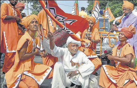  ?? PTI ?? SAFFRON CHEER Supporters of BJP candidate from Gharaunda, Harvinder Singh Kalyan, celebrate his victory on Thursday.