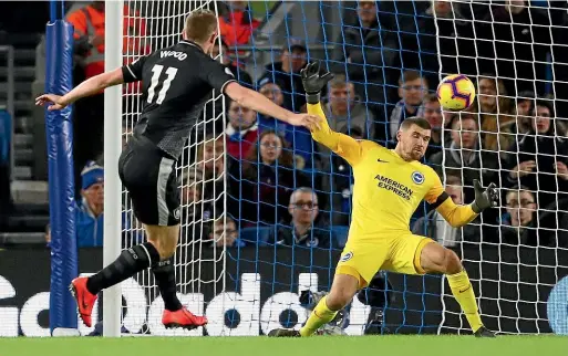  ?? GETTY IMAGES ?? Burnley’sr Chris Wood scores the first of his two goals in Burnley’s 3-0 win over Brighton and Hove Albion yesterday. The Kiwi striker has scored five goals in seven games since Burnley began an unbeaten run in late December.