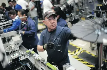  ?? PEDRO PARDO / AFP / GETTY IMAGES ?? An auto parts production line in the Bosch factory in San Luis Potosi, Mexico. Growth in Mexico manufactur­ing edged up in January from a more than three-year low.