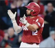  ?? NWA Democrat-Gazette/ANDY SHUPE ?? Arkansas catcher Casey Opitz said that Dickey-Stephens Park in North Little Rock is a great environmen­t to play in.