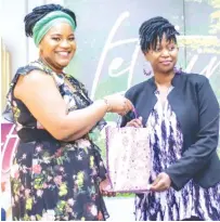  ?? ?? Life Issues with FGK founder and executive director Mrs Fortunate Kufakunesu (left) hands over a token to one of the panelists, Audrey Chirenje at the launch of ‘Letting Go’ in Harare recently