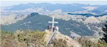  ??  ?? Anzac Day tradition: To climb up to the cross near Tinui.