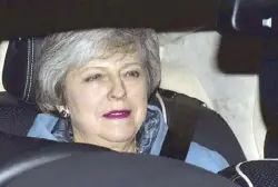  ??  ?? British Prime Minister Theresa May leaves the Houses of Parliament in Westminste­r following a Brexit vote in the House of Commons, in London on Thursday. AP