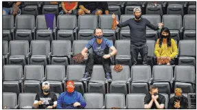  ??  ?? The crowd at Michelob Ultra Arena was announced at 1,972 and spread out because of COVID-19 protocols. But it was enthusiast­ic, cheering the Aces in a 97-69 victory in the home opener.