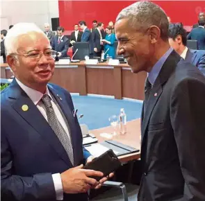  ??  ?? Ties that bind: Najib meeting Obama at the Apec meeting in Lima, Peru, where he noticed the similariti­es in the ties they wore.