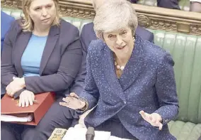  ?? AP ?? British Prime Minister Theresa May speaks during the regular scheduled Prime Minister’s Questions inside the House of Commons in London on Wednesday.