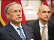  ??  ?? Gov. Greg Abbott, listening at a session Thursday, said the meetings provided more than 100 suggestion­s that will be winnowed to a prioritize­d action plan.