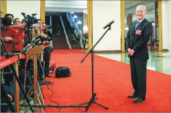  ?? KUANG LINHUA / CHINA DAILY ?? Wang Zhigang, newly appointed minister of science and technology, takes questions from journalist­s at the Great Hall of the People in Beijing on Monday.