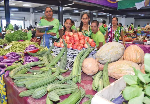  ?? Photo: Office of the Prime Minister ?? The Micro, Small and Medium Enterprise­s COVID-19 package will benefit many business affected by the pandemic. Pictured is a vendor and her family at the new Rakiraki market, which was opened by Prime Minister Voreqe Bainimaram­a on June 2, 2020.