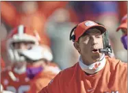  ?? AP-Josh Morgan ?? Clemson head coach Dabo Swinney talks with players during the second half of an NCAA college football game in Clemson, S.C.