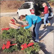  ?? Contribute­d photo ?? Members of the Friends of Gillette Castle State Park spent a recent weekend decorating the grounds and exterior of the late William Gillette’s mansion at 67 River Road in East Haddam.