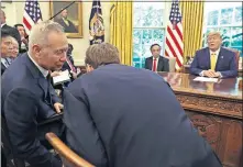  ??  ?? President Donald Trump watches as Chinese Vice Premier Liu He speaks to U.S. Trade representa­tive Robert Lighthizer, right, in the Oval Office of the White House in Washington. [AP PHOTO]