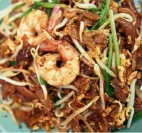  ??  ?? Char kway teow is on TasteAtlas’s top 100 traditiona­l dishes, but Singapore takes the credit. — Filepic