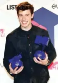 ??  ?? Shawn Mendes poses with The Best Male and The World Wide Act awards backstage, at the MTV European Music Awards 2016 in Rotterdam, Netherland­s.