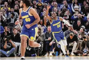  ?? Scott Strazzante/The Chronicle ?? Warriors reserve Jonathan Kuminga reacts to his dunk during Golden State’s 132-95 rout over San Antonio at Chase Center on Monday.