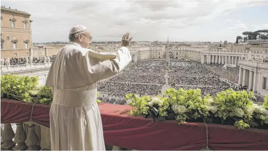  ?? AFP PHOTO/ VATICAN MEDIA ?? Pope Francis delivers the “Urbi et Orbi” blessing from the balcony of St Peter's Basilica after Easter Sunday Mass at Vatican City.