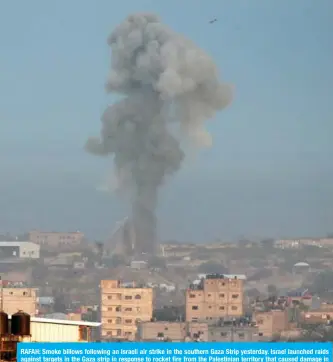 ?? — AFP ?? RAFAH: Smoke billows following an Israeli air strike in the southern Gaza Strip yesterday. Israel launched raids against targets in the Gaza strip in response to rocket fire from the Palestinia­n territory that caused damage in a southern city, the Israeli army said.