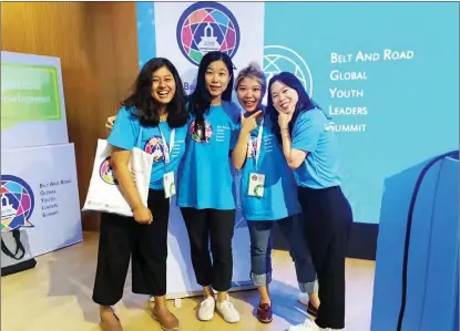  ?? PHOTOS PROVIDED TO CHINA DAILY ?? Aneka Rebecca Rajbhandar­i (left) poses with three other participan­ts at the Belt and Road Global Youth Leaders Summit 2019 in Beijing.