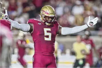  ?? PHIL SEARS / ASSOCIATED PRESS ?? Florida State defensive end Jared Verse gets fired up before a game against Southern Mississipp­i in Tallahasse­e, Fla., on Sept. 9, 2023. Verse grew up in Beavercree­k.