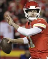 ?? ASSOCIATED PRESS FILE PHOTOS ?? Kirk Cousins, left, is moving on from Washington after the Redskins traded for Kansas City’s Alex Smith on Tuesday.