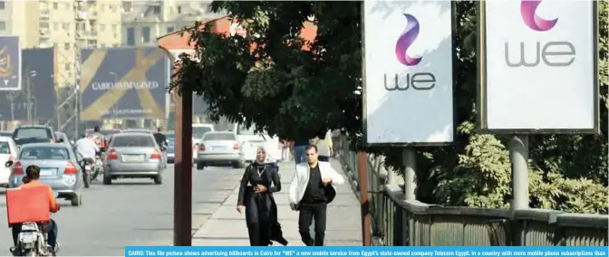  ??  ?? CAIRO: This file picture shows advertisin­g billboards in Cairo for “WE” a new mobile service from Egypt’s state-owned company Telecom Egypt. In a country with more mobile phone subscripti­ons than residents, Egypt’s only fixed-line operator is hoping to...