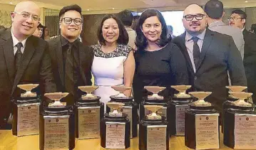  ??  ?? Stratworks’ executive committee with some of the Anvil trophies the agency won: (from left) Group Accounts director Robbie David, PR director Mark Christian Parladé, Promo and Events director Liezl Lucero-Rustia, managing director Donna Nievera-Conda,...