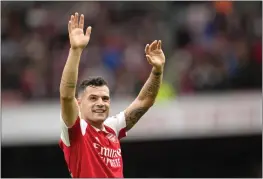 ?? KIRSTY WIGGLESWOR­TH — THE ASSOCIATED PRESS ?? Arsenal's Granit Xhaka celebrates their victory at the English Premier League soccer match between Arsenal and Crystal Palace at Emirates stadium in London on Sunday.