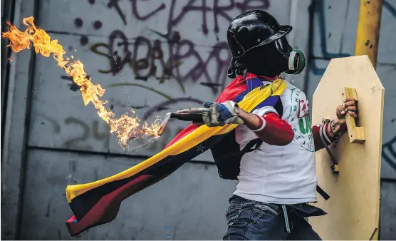  ?? JUAN BARRETO/AFP/GETTY IMAGES ?? Anti-government unrest, deteriorat­ing living conditions and skyrocketi­ng inflation have contribute­d to dampening the economic outlook in Venezuela.