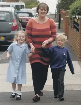  ??  ?? WALK ON: Donna Warwick with children Sophie and Brandon.