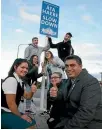  ??  ?? Students from Te Puna Ma¯tauranga with the city’s first bilingual road sign.