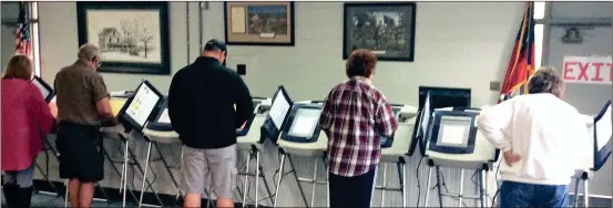  ??  ?? Voters in Walker and Catoosa counties rely on electronic voting machines during local, state and national elections as in this file photo from Chickamaug­a.