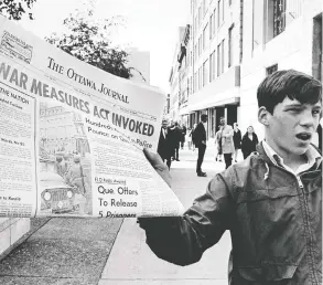  ?? PETER BREGG / THE CANADIAN PRESS FILES ?? A newspaper in October 1970 with a banner headline reporting that the War Measures Act had been invoked for the first time in Canada in peacetime.