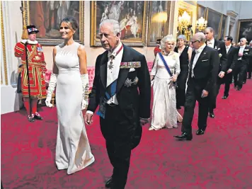  ??  ?? Donald Trump and his wife Melania, who was accompanie­d to the state banquet by the Prince of Wales, above, dined at the top table with the Queen, right. Among those present were the Duchess of Cambridge, far left, who wore earrings that had belonged to the late Queen Elizabeth the Queen Mother, and Ivanka Trump, left, wearing a gown by Carolina Herrera worth £9,200. The Queen wore Angela Kelly, while the US First Lady favoured Dior Haute Couture