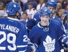  ?? CHRIS SO/THE CANADIAN PRESS ?? The Leafs’ Mitch Marner, right, leads all NHL rookies with 39 points.