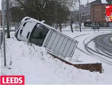  ??  ?? Overturned: A van that skidded out of control LEEDS
