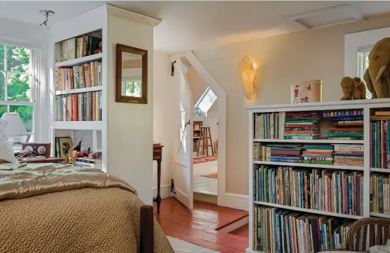  ??  ?? ABOVE Book nooks are even cut into walls. The owner fashioned the powder-room mirror from an old snowshoe. The soap dish/glass holder is a salvage find. BELOW The guest-room bookcase, part of a radiator cabinet, lends privacy as a room divider.