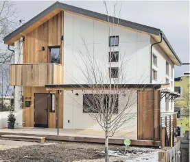  ??  ?? Seattle’s second Built Green Emerald Star home, with three levels and 3,160 square feet, is in a high-walk-score neighbourh­ood of West Seattle. The lower-level unit is rented out.