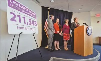  ?? STAFF PHOTO BY PATRICK WHITTEMORE ?? MAKING IT RIGHT: Attorney General Maura Healey announces a $1 million settlement with law firm Lustig, Glaser & Wilson over debt-collection practices during a press conference yesterday.