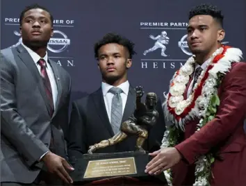  ?? The Associated Press ?? Kyler Murray, center, beat Dwayne Haskins, left, and Tua Tagoviloa for the Heisman Trophy.Alabama quarterbac­k and Heisman runnerup Tua Tagovailoa is expected to be the heavy favorite for next year’s award.